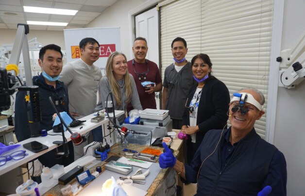 Small-group participant photo in the training lab