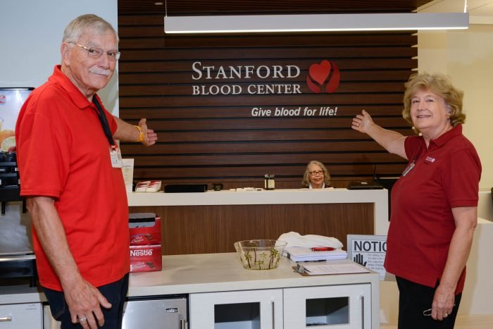 Stanford Blood Center South Bay Donor Center — reception desk with brand signage wall